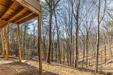 Welcome home to your own private mountainside retreat in Lake on The Highlands Course at Lake Arrowhead in Georgia - for sale on GolfHomes.com, golf home, golf lot