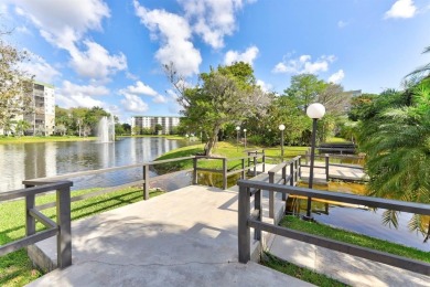 Must see! Highly desirable Cypress Bend community! Completely on Palm-Aire Country Club and Resort - Palms in Florida - for sale on GolfHomes.com, golf home, golf lot