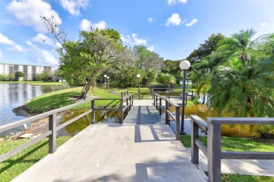 Must see! Highly desirable Cypress Bend community! Completely on Palm-Aire Country Club and Resort - Palms in Florida - for sale on GolfHomes.com, golf home, golf lot
