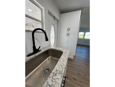 Come make this beautifully remodeled home YOURS!!!. NEW FLOORS on Six Lakes Country Club in Florida - for sale on GolfHomes.com, golf home, golf lot