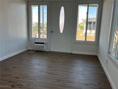 Come make this beautifully remodeled home YOURS!!!. NEW FLOORS on Six Lakes Country Club in Florida - for sale on GolfHomes.com, golf home, golf lot