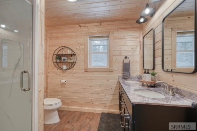 This short term rental sets in the heart of Island Park on Island Park Village Resort Golf Course in Idaho - for sale on GolfHomes.com, golf home, golf lot