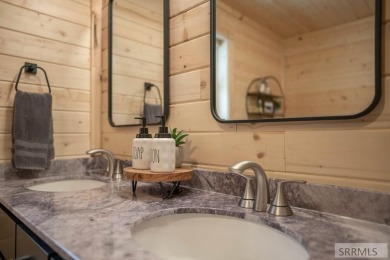 This short term rental sets in the heart of Island Park on Island Park Village Resort Golf Course in Idaho - for sale on GolfHomes.com, golf home, golf lot