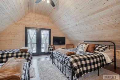 This short term rental sets in the heart of Island Park on Island Park Village Resort Golf Course in Idaho - for sale on GolfHomes.com, golf home, golf lot