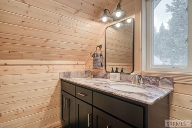 This short term rental sets in the heart of Island Park on Island Park Village Resort Golf Course in Idaho - for sale on GolfHomes.com, golf home, golf lot