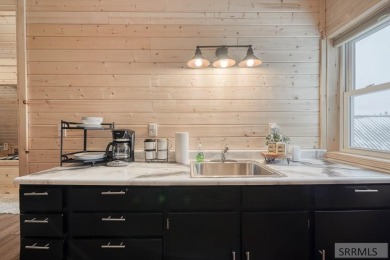 This short term rental sets in the heart of Island Park on Island Park Village Resort Golf Course in Idaho - for sale on GolfHomes.com, golf home, golf lot