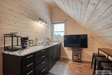 This short term rental sets in the heart of Island Park on Island Park Village Resort Golf Course in Idaho - for sale on GolfHomes.com, golf home, golf lot