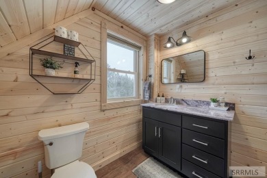 This short term rental sets in the heart of Island Park on Island Park Village Resort Golf Course in Idaho - for sale on GolfHomes.com, golf home, golf lot