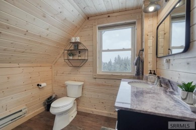 This short term rental sets in the heart of Island Park on Island Park Village Resort Golf Course in Idaho - for sale on GolfHomes.com, golf home, golf lot