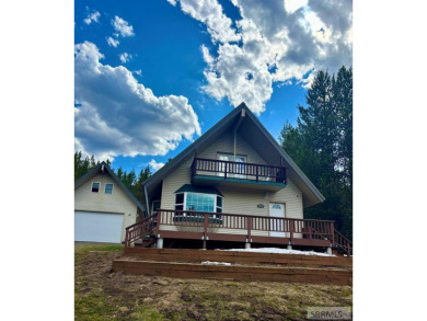 This short term rental sets in the heart of Island Park on Island Park Village Resort Golf Course in Idaho - for sale on GolfHomes.com, golf home, golf lot