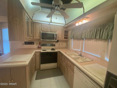 This spacious park model features lots of windows, a woodburning on Juniper Ridge R.V. Golf Resort in Arizona - for sale on GolfHomes.com, golf home, golf lot