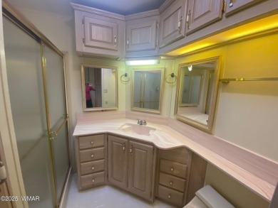 This spacious park model features lots of windows, a woodburning on Juniper Ridge R.V. Golf Resort in Arizona - for sale on GolfHomes.com, golf home, golf lot