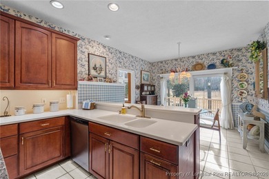 Discover serene golf course living in the prestigious gated on Carolina Trace Country Club in North Carolina - for sale on GolfHomes.com, golf home, golf lot