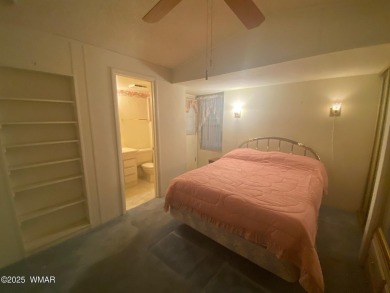 This spacious park model features lots of windows, a woodburning on Juniper Ridge R.V. Golf Resort in Arizona - for sale on GolfHomes.com, golf home, golf lot