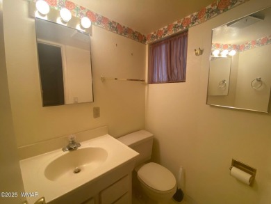 This spacious park model features lots of windows, a woodburning on Juniper Ridge R.V. Golf Resort in Arizona - for sale on GolfHomes.com, golf home, golf lot