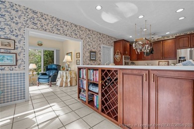 Discover serene golf course living in the prestigious gated on Carolina Trace Country Club in North Carolina - for sale on GolfHomes.com, golf home, golf lot