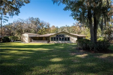 Nestled within the Gainesville Country Club, this extensively on Gainesville Golf and Country Club in Florida - for sale on GolfHomes.com, golf home, golf lot