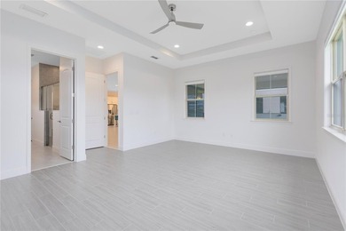 Positioned on one of the most desirable pond and golf view lots on Eagle Creek Golf Club in Florida - for sale on GolfHomes.com, golf home, golf lot