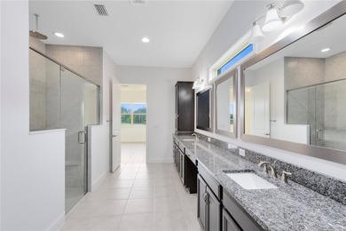 Positioned on one of the most desirable pond and golf view lots on Eagle Creek Golf Club in Florida - for sale on GolfHomes.com, golf home, golf lot