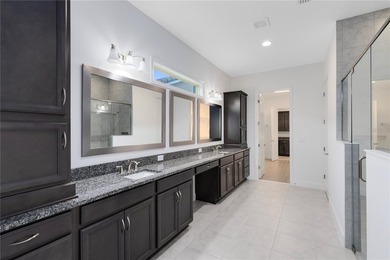 Positioned on one of the most desirable pond and golf view lots on Eagle Creek Golf Club in Florida - for sale on GolfHomes.com, golf home, golf lot