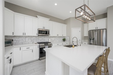 This contemporary home is located in the beautiful and gated Los on Los Lagos Golf Club in Arizona - for sale on GolfHomes.com, golf home, golf lot