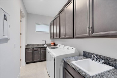 Positioned on one of the most desirable pond and golf view lots on Eagle Creek Golf Club in Florida - for sale on GolfHomes.com, golf home, golf lot