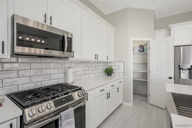 This contemporary home is located in the beautiful and gated Los on Los Lagos Golf Club in Arizona - for sale on GolfHomes.com, golf home, golf lot