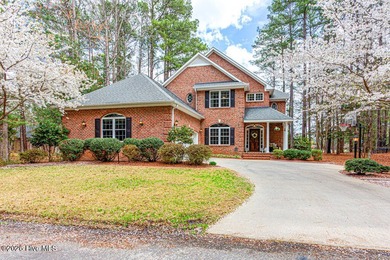 Stunning waterfront brick home located in the gated community of on Woodlake Country Club in North Carolina - for sale on GolfHomes.com, golf home, golf lot