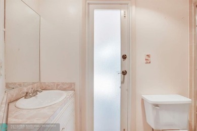 A rare offering in one of South Florida's most cherished on Cooper Colony Country Club in Florida - for sale on GolfHomes.com, golf home, golf lot