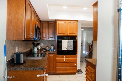 3 bedrooms, 2 bath condo. Upgraded kitchen cabinets, granite on Leisure World Country Club in Arizona - for sale on GolfHomes.com, golf home, golf lot