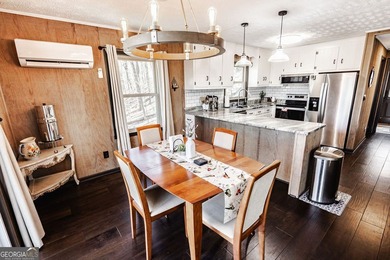 This updated 4-bedroom, 3-bath home is tucked into the Bent Tree on Bent Tree Golf Course in Georgia - for sale on GolfHomes.com, golf home, golf lot