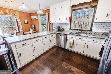 This updated 4-bedroom, 3-bath home is tucked into the Bent Tree on Bent Tree Golf Course in Georgia - for sale on GolfHomes.com, golf home, golf lot