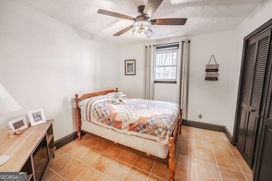 This updated 4-bedroom, 3-bath home is tucked into the Bent Tree on Bent Tree Golf Course in Georgia - for sale on GolfHomes.com, golf home, golf lot