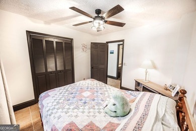 This updated 4-bedroom, 3-bath home is tucked into the Bent Tree on Bent Tree Golf Course in Georgia - for sale on GolfHomes.com, golf home, golf lot