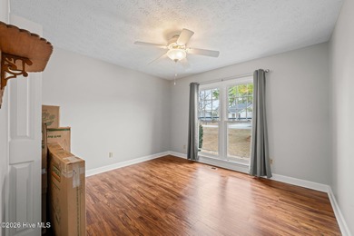 This well-maintained brick home sits on a spacious corner lot in on Harbour Point Golf Club in North Carolina - for sale on GolfHomes.com, golf home, golf lot