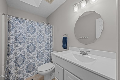 This well-maintained brick home sits on a spacious corner lot in on Harbour Point Golf Club in North Carolina - for sale on GolfHomes.com, golf home, golf lot