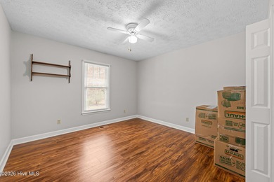 This well-maintained brick home sits on a spacious corner lot in on Harbour Point Golf Club in North Carolina - for sale on GolfHomes.com, golf home, golf lot