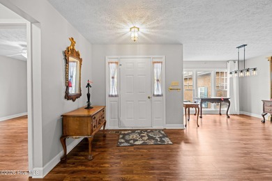 This well-maintained brick home sits on a spacious corner lot in on Harbour Point Golf Club in North Carolina - for sale on GolfHomes.com, golf home, golf lot