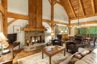 This beautiful, fully furnished, 3-bedroom, 2.5-bath wood cabin on Sapphire National Golf Club in North Carolina - for sale on GolfHomes.com, golf home, golf lot