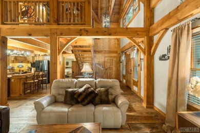 This beautiful, fully furnished, 3-bedroom, 2.5-bath wood cabin on Sapphire National Golf Club in North Carolina - for sale on GolfHomes.com, golf home, golf lot