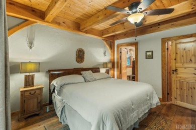 This beautiful, fully furnished, 3-bedroom, 2.5-bath wood cabin on Sapphire National Golf Club in North Carolina - for sale on GolfHomes.com, golf home, golf lot