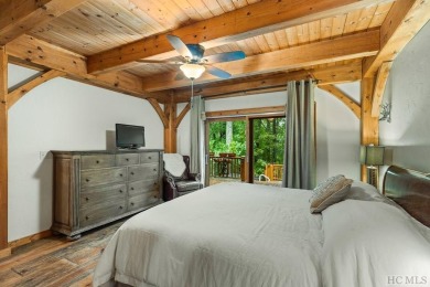 This beautiful, fully furnished, 3-bedroom, 2.5-bath wood cabin on Sapphire National Golf Club in North Carolina - for sale on GolfHomes.com, golf home, golf lot