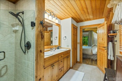 This beautiful, fully furnished, 3-bedroom, 2.5-bath wood cabin on Sapphire National Golf Club in North Carolina - for sale on GolfHomes.com, golf home, golf lot