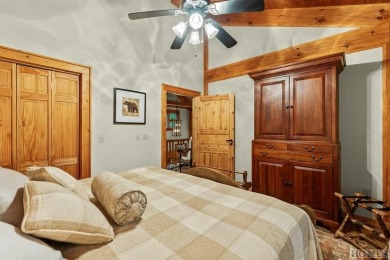 This beautiful, fully furnished, 3-bedroom, 2.5-bath wood cabin on Sapphire National Golf Club in North Carolina - for sale on GolfHomes.com, golf home, golf lot