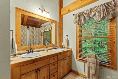 This beautiful, fully furnished, 3-bedroom, 2.5-bath wood cabin on Sapphire National Golf Club in North Carolina - for sale on GolfHomes.com, golf home, golf lot