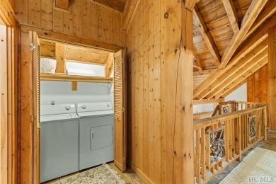 This beautiful, fully furnished, 3-bedroom, 2.5-bath wood cabin on Sapphire National Golf Club in North Carolina - for sale on GolfHomes.com, golf home, golf lot