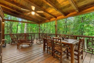 This beautiful, fully furnished, 3-bedroom, 2.5-bath wood cabin on Sapphire National Golf Club in North Carolina - for sale on GolfHomes.com, golf home, golf lot