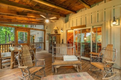 This beautiful, fully furnished, 3-bedroom, 2.5-bath wood cabin on Sapphire National Golf Club in North Carolina - for sale on GolfHomes.com, golf home, golf lot