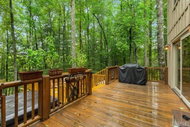 This beautiful, fully furnished, 3-bedroom, 2.5-bath wood cabin on Sapphire National Golf Club in North Carolina - for sale on GolfHomes.com, golf home, golf lot