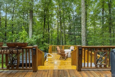 This beautiful, fully furnished, 3-bedroom, 2.5-bath wood cabin on Sapphire National Golf Club in North Carolina - for sale on GolfHomes.com, golf home, golf lot